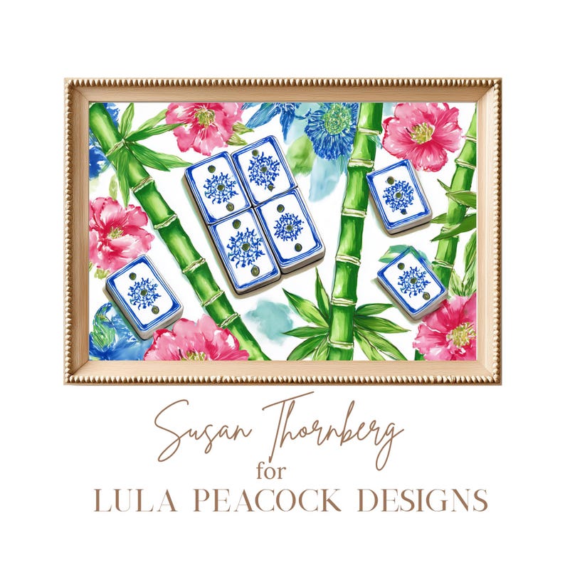 May include: A framed print featuring a watercolor design with bamboo stalks, pink flowers, and blue floral accents. Several blue and white tiles are scattered across the image. The print is signed "Susan Thornberg for LULA PEACOCK DESIGNS."