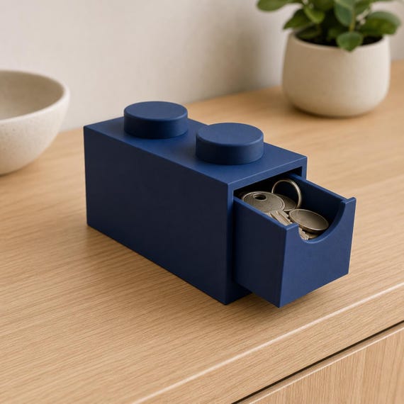 Dark blue 2x1 storage drawer on an entryway console