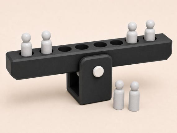 High three-quarter view of the Graphite Lab showing four filled slots, four empty slots, and two spare peg weights.