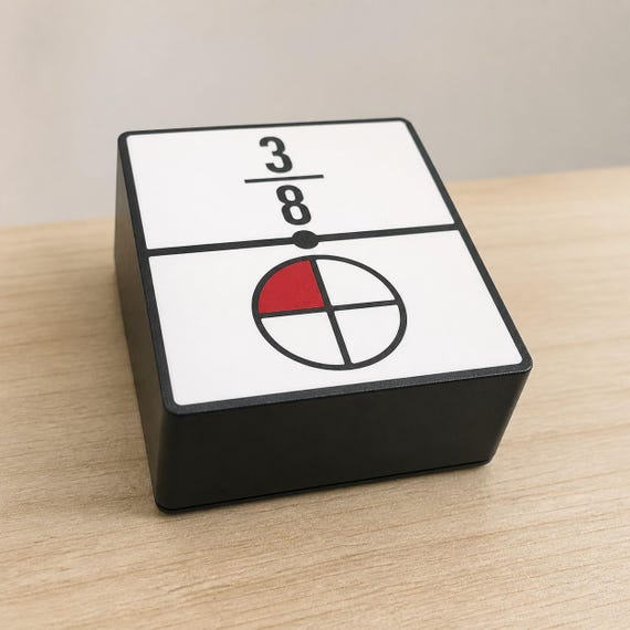 Closed black EqualLink storage box with a white face showing three eighths and one red quarter, viewed from the front corner.