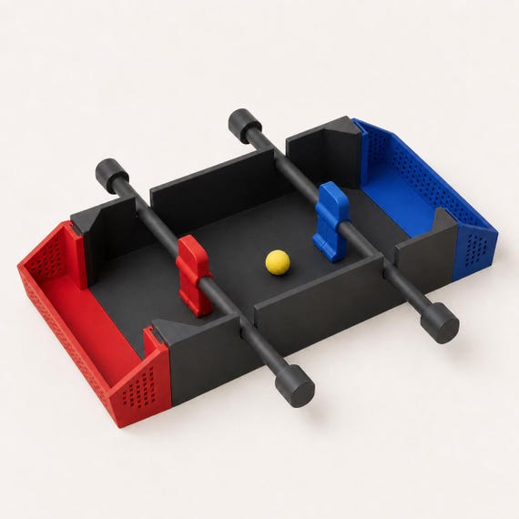 Catalan Night colorway with a Charcoal body, Scarlet Red left team, Dark Blue right team, and Lemon Yellow ball