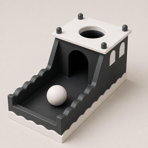High three-quarter view of the Midnight Castle toy showing the roof opening, four corner pins, arched windows, and one ball.