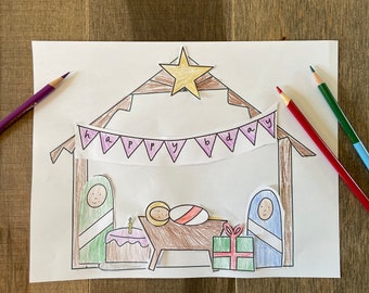 May include: A printable coloring page featuring a nativity scene with a star, a manger, a baby Jesus, Mary, Joseph, a birthday cake, and a gift. The banner above the manger reads "happy birthday".