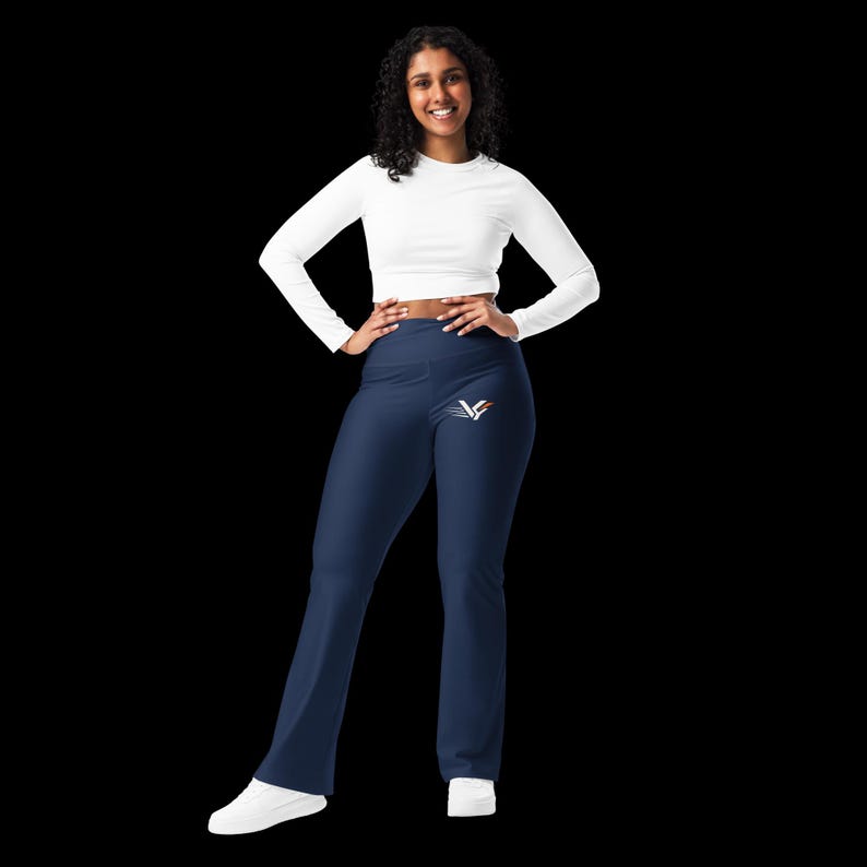 Navy VYND high-waisted flare leggings on a model