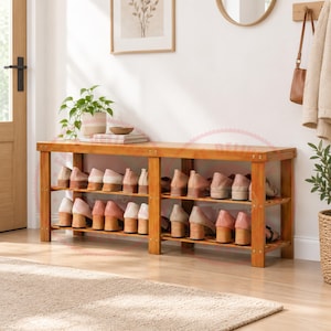 May include: A rectangular wooden shoe rack with two tiers of shelving. The frame is constructed from light brown wood with visible grain. The rack holds multiple pairs of light-coloured shoes arranged neatly on both the top and bottom shelves.