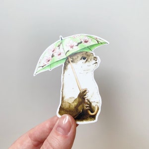 Otter with Umbrella Vinyl Sticker - laptop, water bottle, and car decal