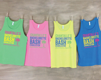 May include: Four tank tops in different colors, green, pink, yellow, and blue, with the text "CHANTALLE'S BACHELORETTE BASH CHARLESTON" printed on each. The text is in a blue font with a pink palm tree graphic.
