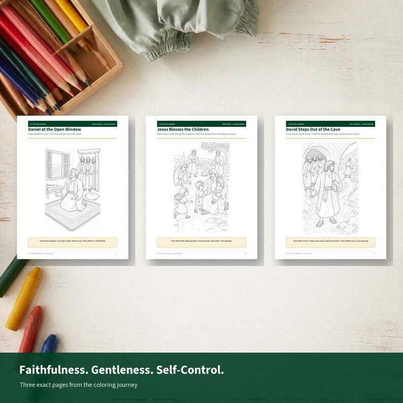May include: Three white coloring pages featuring black line art illustrations titled Daniel at the Open Window, Jesus Blesses the Children, and David Steps Out of the Cave, accompanied by a wooden box of colored pencils and a green fabric cloth.