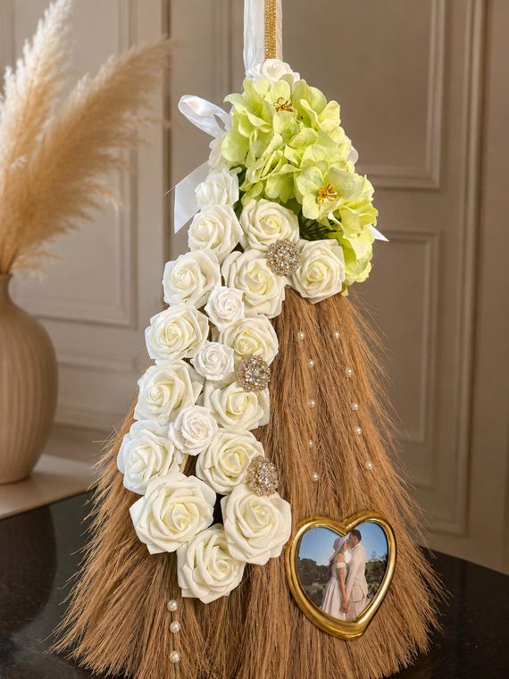 A hand-decorated ceremonial jumping broom — a culturally rich, one-of-a-kind heirloom piece you genuinely cannot find at any big-box store.