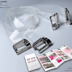 May include: Clear bra straps with silver-colored metal clasps and a detailed instruction sheet. The image shows two clear bra straps, two metal clasps, and a booklet titled "NO-SEW NO-SLIP PIN STRAPS."