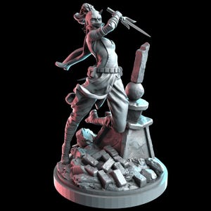 May include: A gray unpainted resin miniature figurine of a warrior in a dynamic pose, holding a three-pronged sai weapon. The figure wears a mask and flowing garments, standing atop a base featuring scattered brick rubble and a stone pillar.