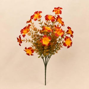 May include: A bouquet of artificial flowers featuring multiple blossoms with vibrant orange and yellow petals. The flowers are attached to thin green stems with small, pointed green leaves, all gathered into a single central stalk at the base.