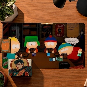 May include: A rectangular playmat featuring four South Park characters playing a card game at a table. The scene includes a poster with the text I CAST FIST and PLANESWALKER CODE. A small box with an illustration of a dark-haired warrior sits in the foreground, alongside a green soda can and a single card.