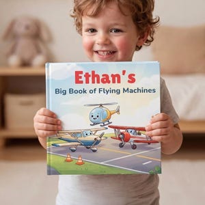 May include: A hardback book titled Ethan's Big Book of Flying Machines. The cover features a cartoon illustration of a blue and yellow helicopter, a blue and white aeroplane, and a red and white biplane on an airport runway with orange cones.