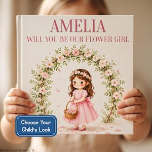 May include: A hardcover book with the title AMELIA WILL YOU BE OUR FLOWER GIRL printed in pink. The cover features an illustration of a girl in a pink dress holding a basket under a floral arch. A blue rectangular label reads Choose Your Child's Look.
