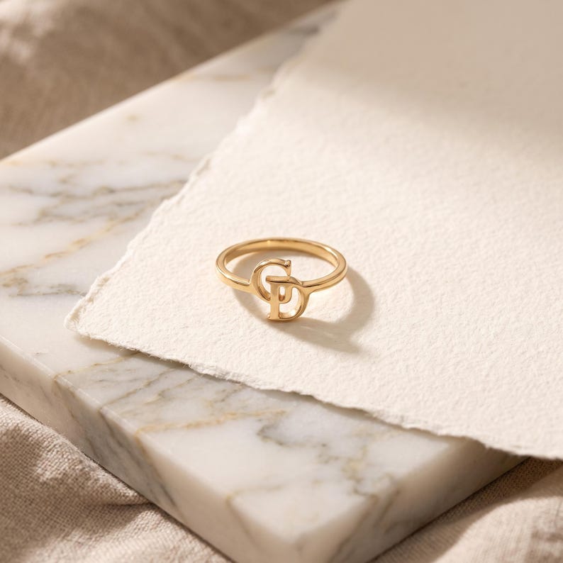 Custom two letter ring with elegant overlapping initials, personalized gold jewelry for women and a thoughtful sentimental gift.