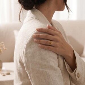 Personalized gold ring with two custom intertwined initials, unique jewelry created from meaningful letters for everyday wear.