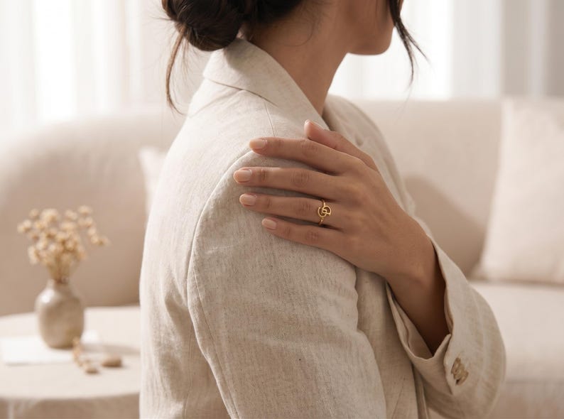 Personalized gold ring with two custom intertwined initials, unique jewelry created from meaningful letters for everyday wear.