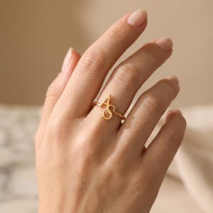 Custom two letter ring with elegant overlapping initials, personalized gold jewelry for women and a thoughtful sentimental gift.