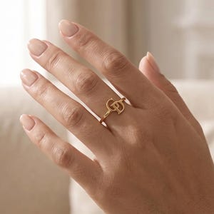 Romantic intertwined initials ring personalized with two letters, meaningful gold couple jewelry and special gift for someone you love.