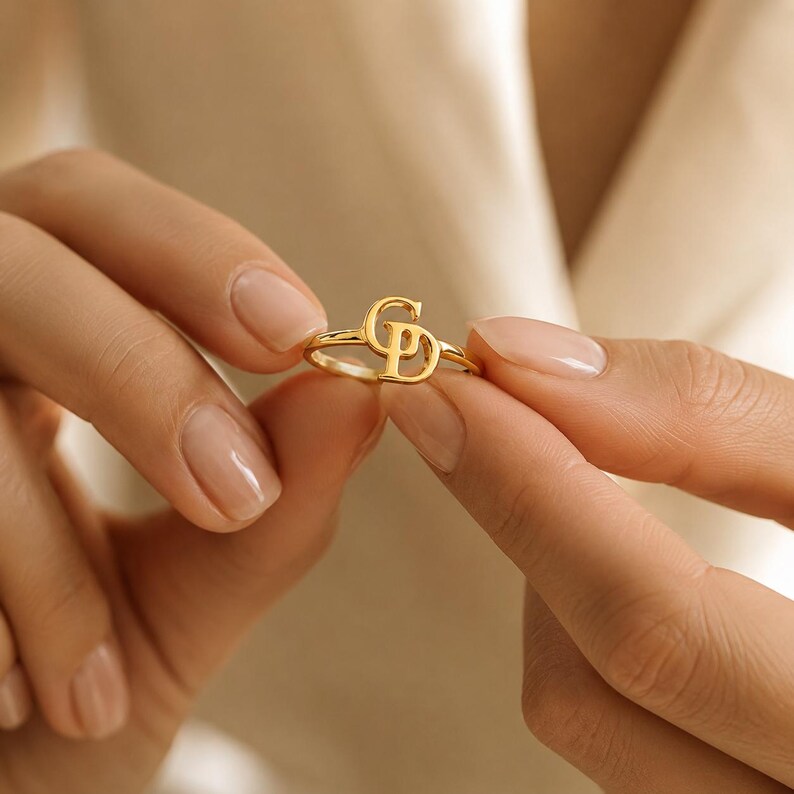 Interlocking initials gold ring with two personalized letters, elegant custom jewelry for women and a meaningful everyday keepsake.