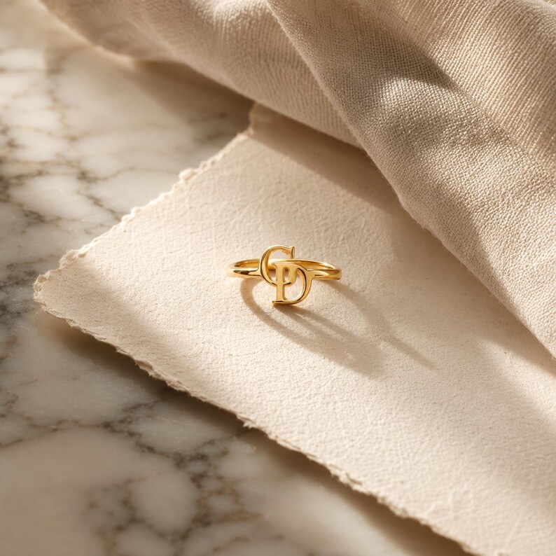 Personalized gold ring with two custom intertwined initials, unique jewelry created from meaningful letters for everyday wear.