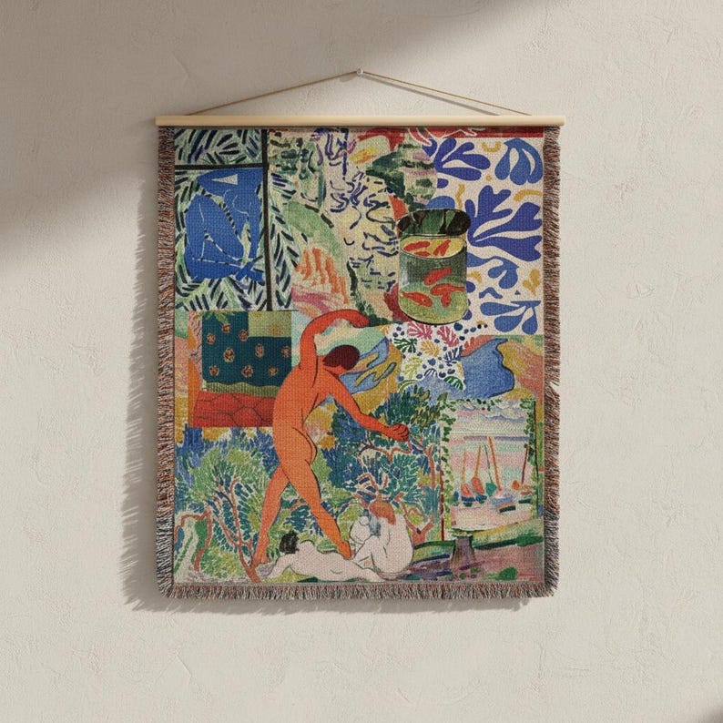 May include: A rectangular woven wall tapestry featuring a multi-paneled artistic composition with vibrant colors. The design includes a central orange figure, a green fishbowl with red fish, blue abstract shapes, and various landscape elements.