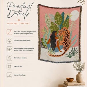May include: A woven wall tapestry measuring 130 x 160 cm or 51 x 63 inches. The design features a person with long dark hair sitting among green tropical leaves next to an orange and black spotted leopard against a pink and white background.