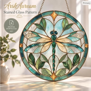 May include: A circular stained glass pattern featuring a central dragonfly with teal and amber wings. The design includes green leaf motifs, a geometric border, and a hanging chain. Text on the image reads ArshAuream Stained Glass Pattern.