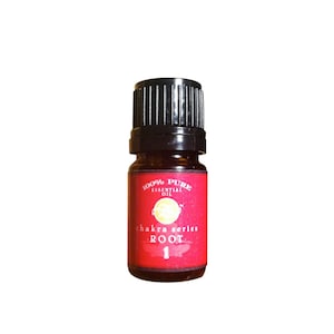 May include: A small amber glass bottle with a black cap. The label is red with white text that reads "100% Pure Essential Oil Chakra Series Root 1".