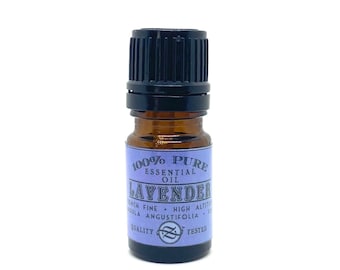 May include: A small brown glass bottle with a black cap, labeled "100% Pure Essential Oil Lavender French Fine - High Altitude Lavandula Angustifolia - Quality Tested".