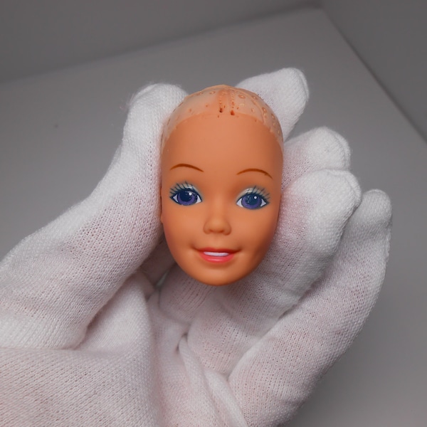 Vintage Barbie head marked Taiwan 1976 inside the rim, Barbie Dream Glow 1986 bald head only.