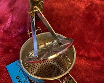 Hand strainer metal squeeze style nice piece