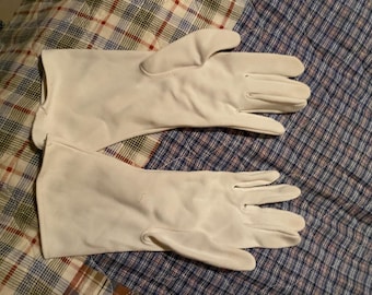 Nice white gloves size small to medium, one has a cuff that needs sewn