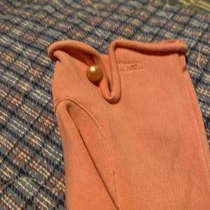 May include: A set of three ceramic mugs with a speckled, matte finish. The mugs are in shades of cream, light gray, and dark gray. Each mug has a simple, minimalist design, perfect for coffee or tea.