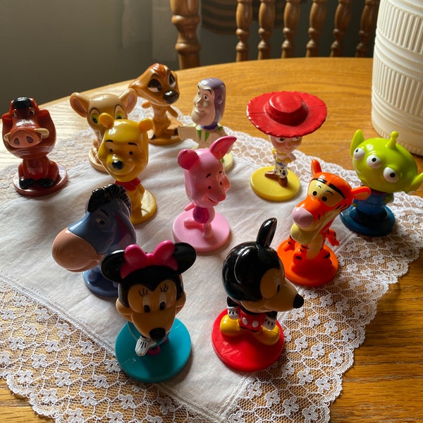 Very cute Disney set of 12 bobble heads! Love them very good condition