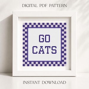 May include: A digital PDF cross stitch pattern featuring the text GO CATS in dark purple block letters. The design is centered within a white square, surrounded by a purple and white checkered border, all displayed inside a white square frame.