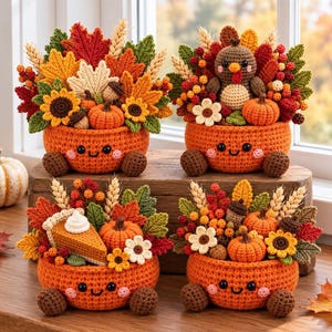 May include: Four crocheted orange bowls with smiling faces, each filled with autumn-themed decor including crocheted pumpkins, sunflowers, maple leaves, wheat stalks, berries, and acorns. One bowl features a crocheted turkey and another a slice of pie.