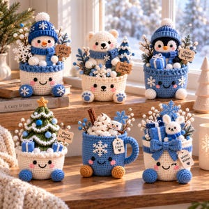 May include: Six crocheted winter-themed figurines in containers. Includes a snowman, polar bear, penguin, Christmas tree, hot cocoa mug, and a rabbit with gifts. Each features blue and white yarn, snowflake accents, and small wooden signs with text.