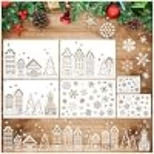 May include: A collection of white plastic stencils featuring various holiday designs including Dutch-style canal houses, evergreen trees, and assorted snowflake patterns in multiple sizes, arranged in a grid and a long horizontal strip.