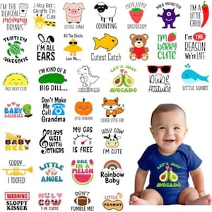 May include: A collection of thirty-five graphic designs featuring cartoon animals, food, and text, alongside a baby wearing a navy blue short-sleeve bodysuit with a green avocado graphic and the text Let's Just Avocado printed on the front.