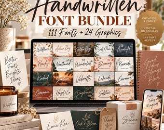 May include: A digital product display featuring The Handwritten Font Bundle with 111 fonts and 24 graphics. A laptop screen shows a grid of font samples, surrounded by printed cards, a candle, a notebook, and a smartphone displaying text.