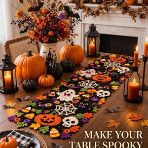 May include: A black crochet table runner featuring colorful motifs of ghosts, skulls, pumpkins, spiderwebs, and candy corn. The runner is displayed on a wooden table surrounded by orange and black pumpkins, lanterns, and autumn floral arrangements.