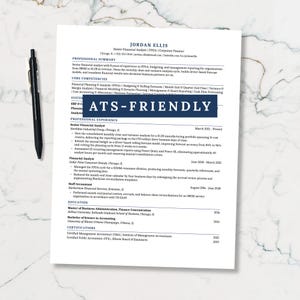 May include: A printed resume document for a Senior Financial Analyst named Jordan Ellis, featuring sections for professional summary, core competencies, and experience. A black pen lies to the left of the paper, which includes a dark blue banner with the white text ATS-FRIENDLY.