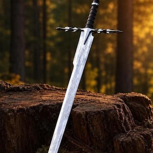 May include: A long steel sword with a textured, silver-toned blade and a dark, ribbed handle. The crossguard features intricate, pointed metal detailing extending outwards. The sword is positioned vertically, with its tip pointing downwards.