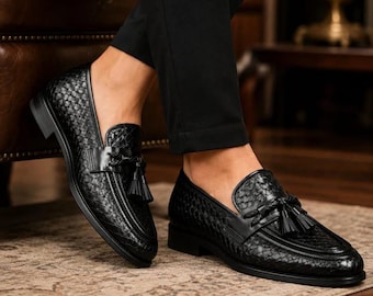 Zwarte geweven loafers met kwastjes voor heren, instapschoenen met textuur.