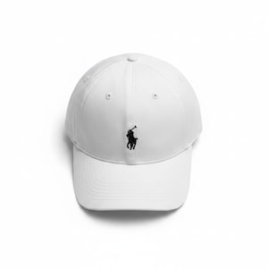 May include: A white baseball cap featuring a black embroidered logo of a polo player on a horse centered on the front panel. The cap has a structured crown, a curved brim, and stitched eyelets for ventilation on the top panels of the hat.