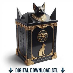 Op de afbeelding: Een zwart-gouden rechthoekige doos met een Egyptische kattenkop op het deksel, het Oog van Horus en een silhouet van een kat. De zijkanten zijn versierd met hiërogliefen en gouden hoekaccenten. De tekst luidt DIGITAL DOWNLOAD STL.