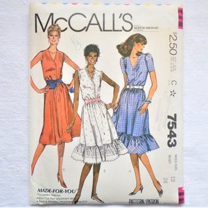 May include: Vintage McCall's sewing pattern for a dress, featuring three women wearing different styles of dresses. The pattern number is 7543 and the size is 12, bust 34. The pattern is titled "Made-For-You".