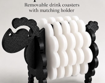 May include: A Sheep Coaster Set with removable drink coasters and a matching holder. The black holder is shaped like a sheep's head and tail, while the white coasters form the body. Text reads: Sheep Coaster Set, Removable drink coasters with matching holder.